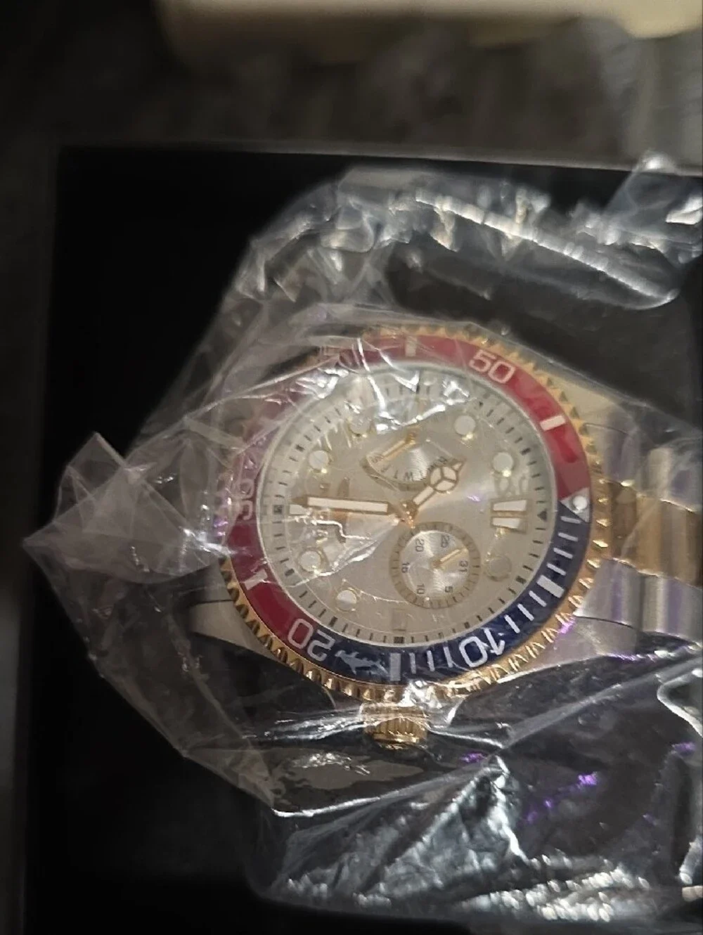 Invicta Two-Tone Gold & Silver Watch with Red and Blue Bezel